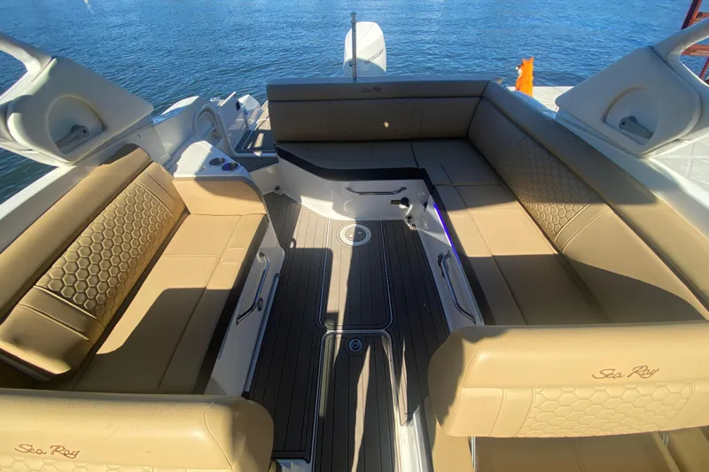  Yacht Photos Pics 2022 Sea Ray SDX 270 Outboard boat interior with tan seating and water view.