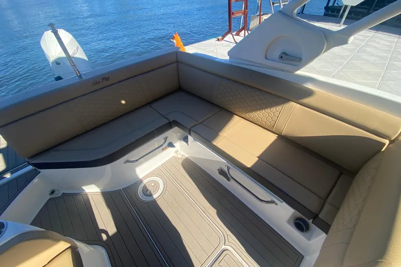  Yacht Photos Pics 2022 Sea Ray SDX 270 Outboard boat interior with tan seating and water view.