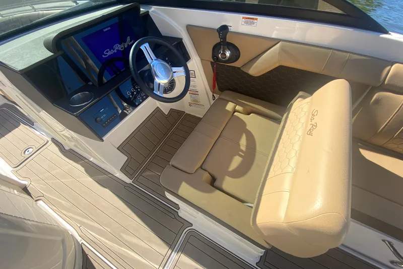  Yacht Photos Pics 2022 Sea Ray SDX 270 Outboard cockpit with beige seating and modern steering console.