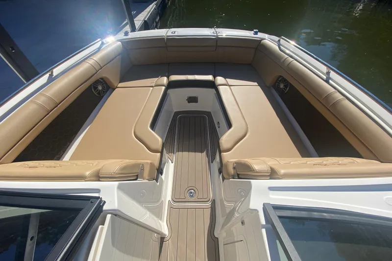  Yacht Photos Pics 2022 Sea Ray SDX 270 Outboard boat interior with tan seating and spacious layout.