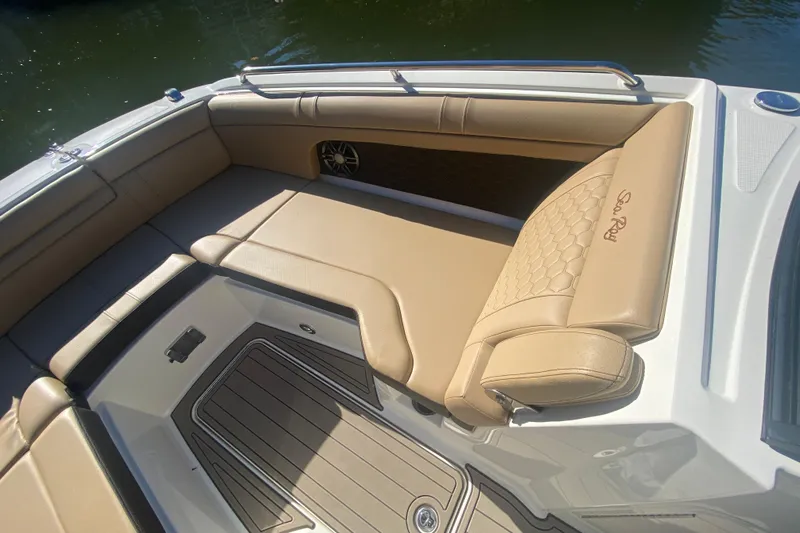  Yacht Photos Pics 2022 Sea Ray SDX 270 Outboard boat interior with tan seating and speaker.