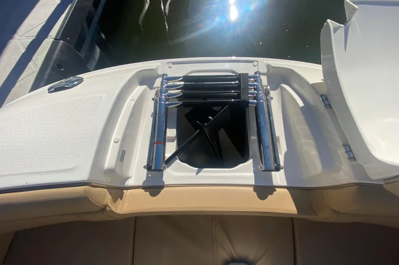  Yacht Photos Pics 2022 Sea Ray SDX 270 Outboard boat with open storage compartment and ladder.
