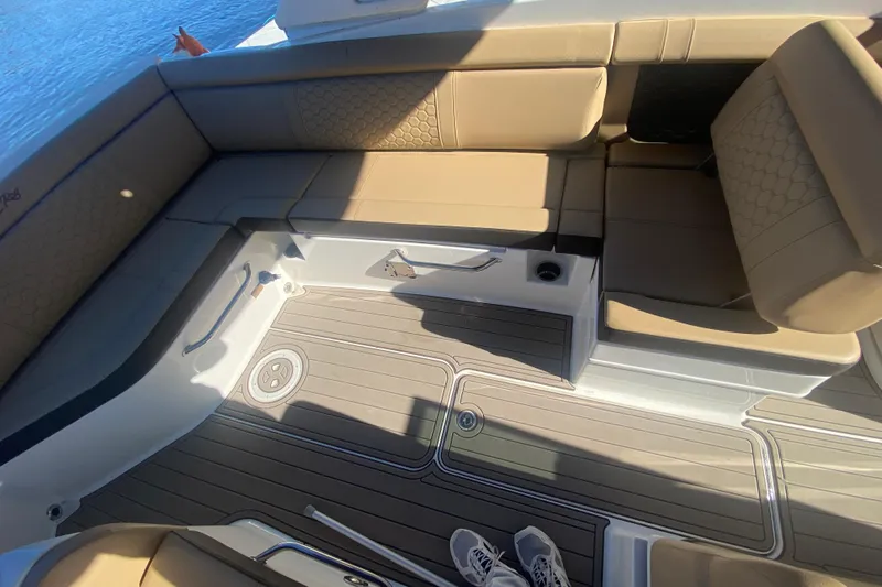  Yacht Photos Pics 2022 Sea Ray SDX 270 Outboard interior with tan seating and deck details.