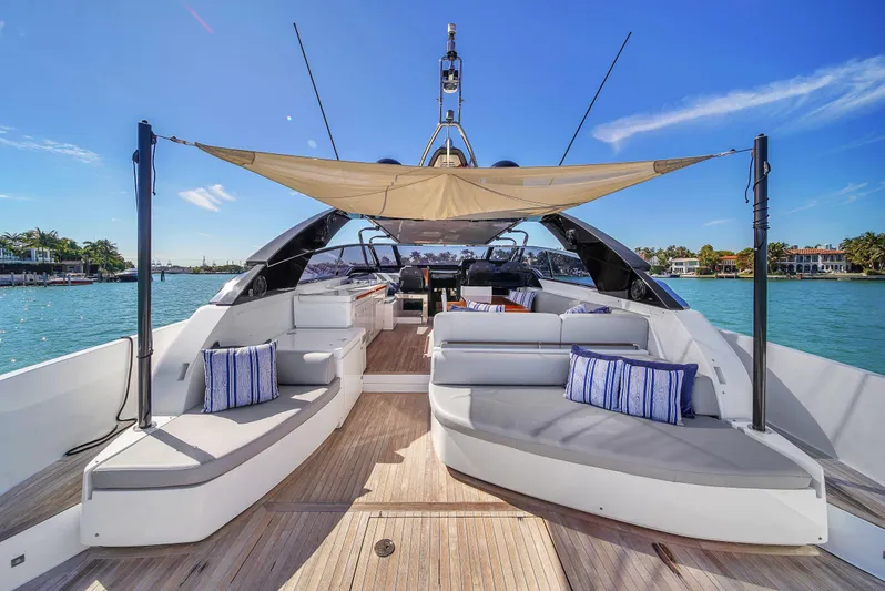  Yacht Photos Pics Luxurious 2018 Riva 76' Bahamas yacht with elegant seating and sunshade on deck.