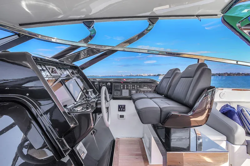  Yacht Photos Pics Cockpit of 2018 Riva 76' Bahamas yacht with modern controls and luxurious seating.