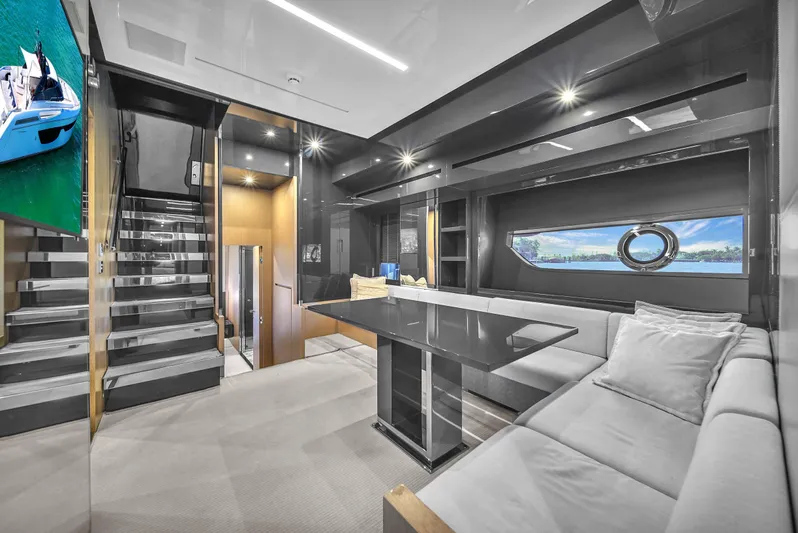  Yacht Photos Pics Luxurious interior of 2018 Riva 76' Bahamas yacht with modern design and comfortable seating.