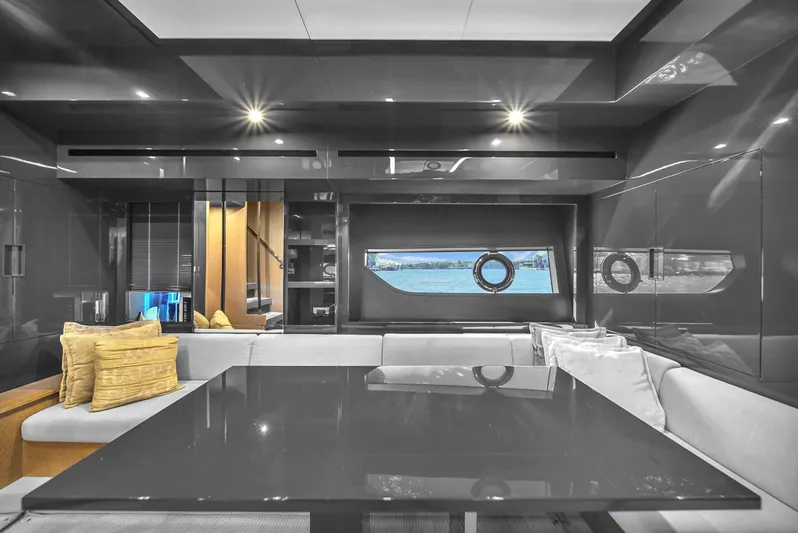  Yacht Photos Pics Luxurious interior of 2018 Riva 76' Bahamas yacht with sleek design and modern furnishings.