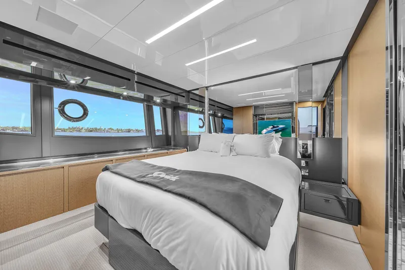  Yacht Photos Pics Luxurious bedroom interior of 2018 Riva 76' Bahamas yacht with ocean view.