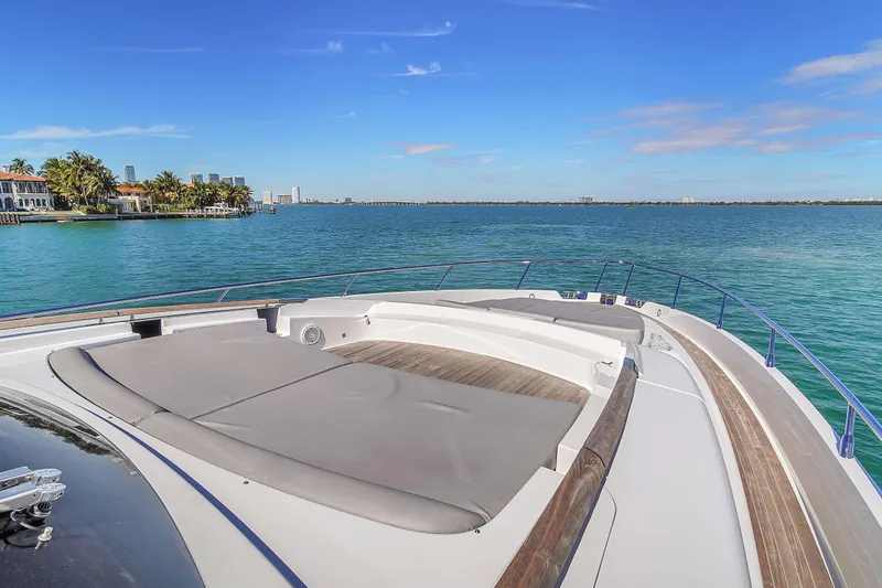  Yacht Photos Pics 2018 Riva 76' Bahamas yacht with spacious deck, overlooking serene blue waters.