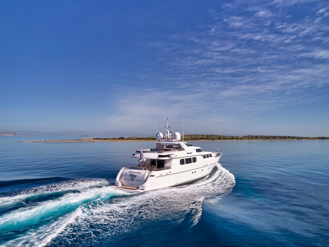 Luxury Codecasa 115 yacht cruising on clear blue waters, 2000 model.
