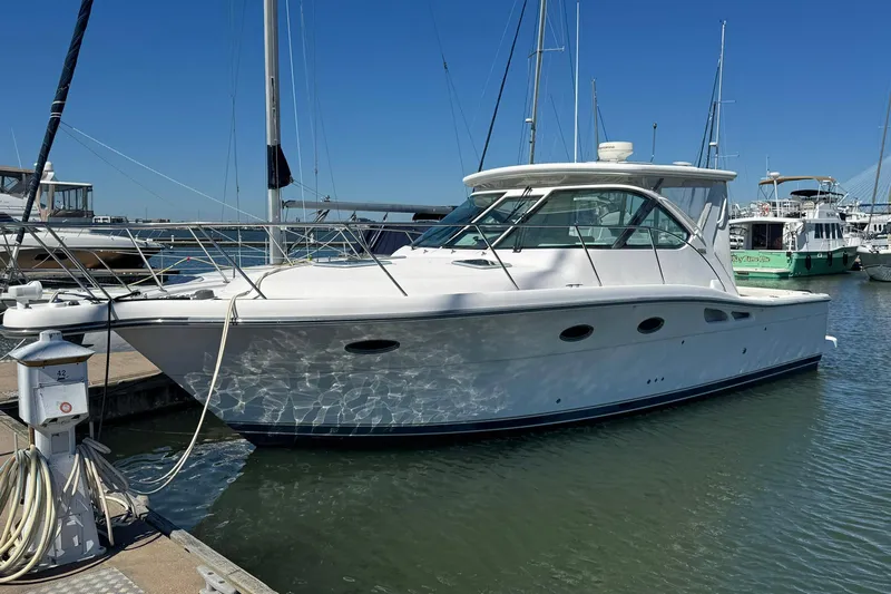 Lone Star Yacht Photos Pics 2005 Tiara Yachts 3200 Open docked at marina under clear blue sky.