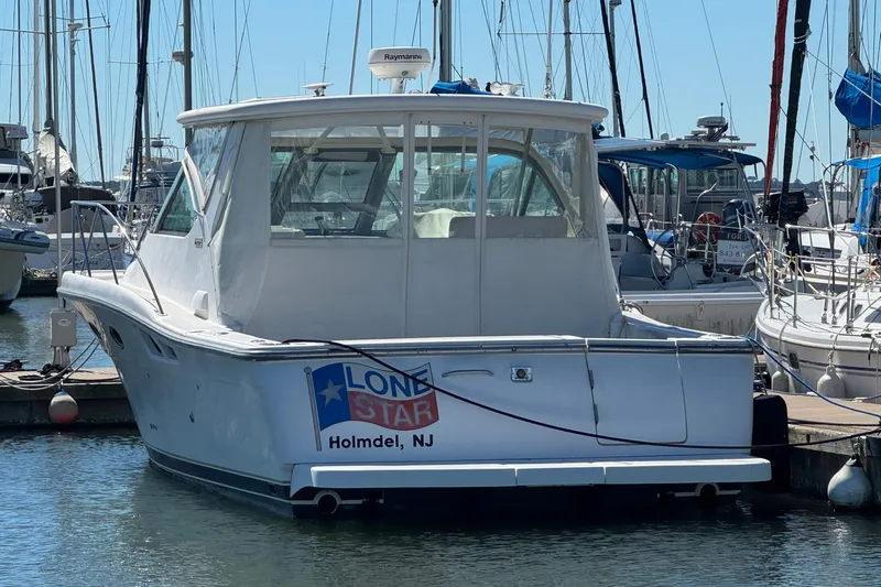 Lone Star Yacht Photos Pics 2005 Tiara Yachts 3200 Open docked at marina, labeled "Lone Star," Holmdel, NJ.