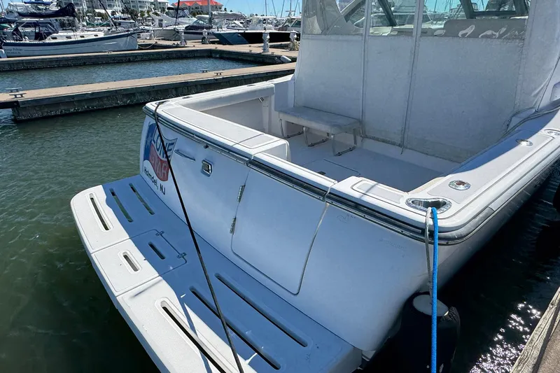 Lone Star Yacht Photos Pics 2005 Tiara Yachts 3200 Open docked at marina, rear view.