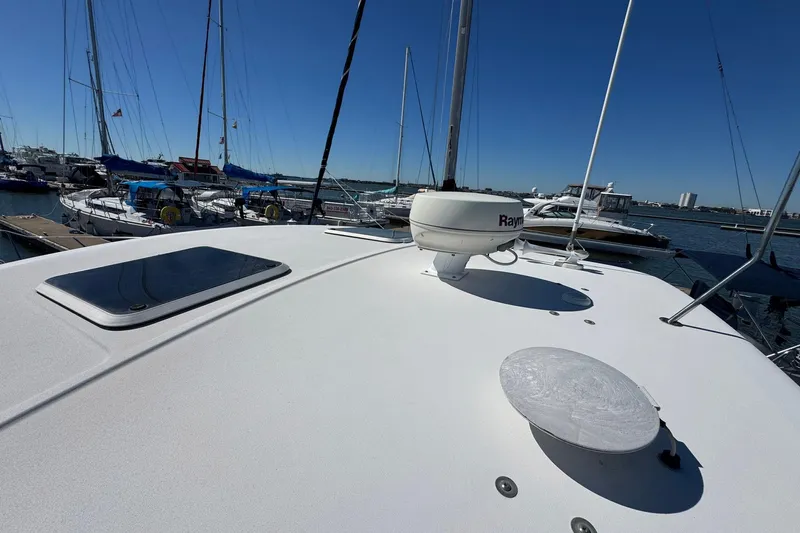 Lone Star Yacht Photos Pics 2005 Tiara Yachts 3200 Open docked at marina, clear sky, calm waters.