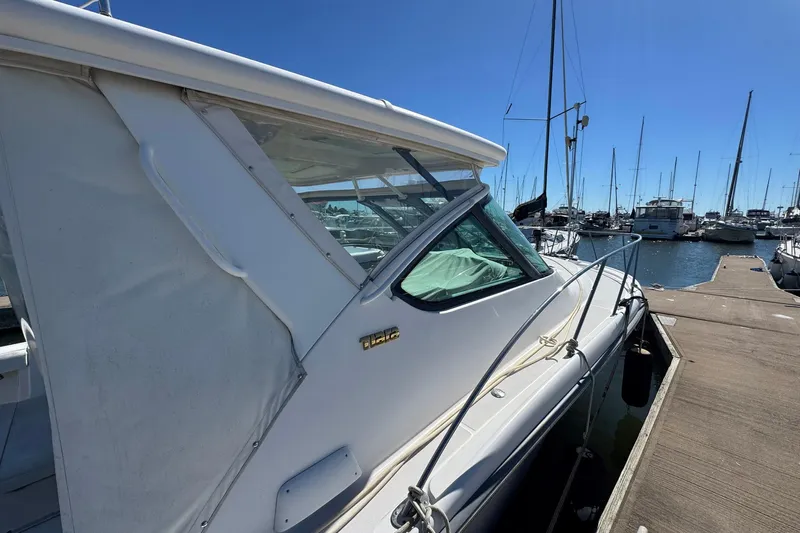Lone Star Yacht Photos Pics 2005 Tiara Yachts 3200 Open docked at marina under clear blue sky.