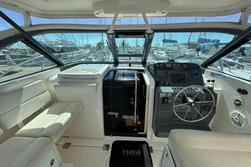 Lone Star Yacht Photos Pics 2005 Tiara Yachts 3200 Open helm with modern controls and marina view.