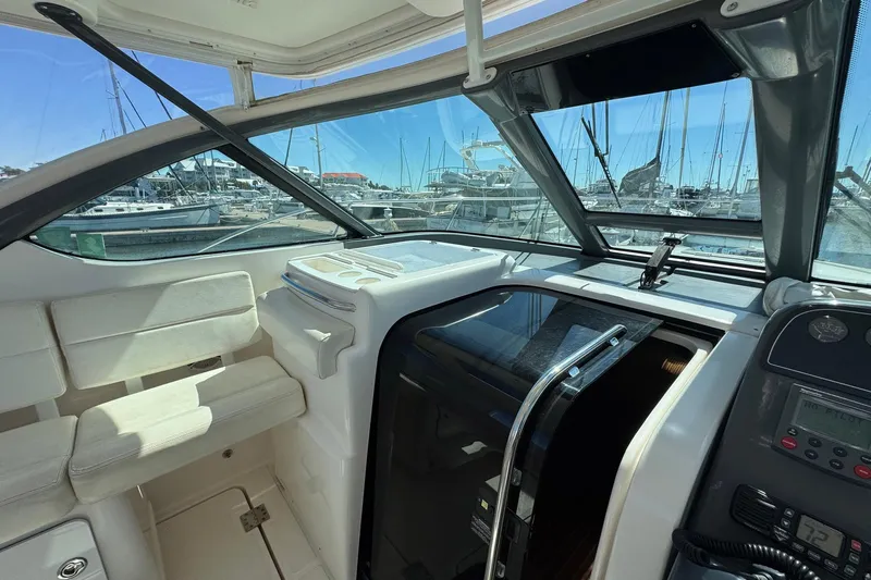 Lone Star Yacht Photos Pics 2005 Tiara Yachts 3200 Open interior with marina view through windows.
