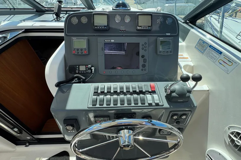 Lone Star Yacht Photos Pics Control panel of a 2005 Tiara Yachts 3200 Open, featuring navigation and communication equipment.
