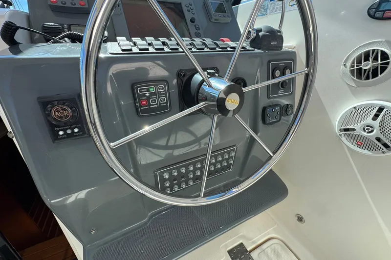 Lone Star Yacht Photos Pics Steering wheel and control panel of 2005 Tiara Yachts 3200 Open boat.