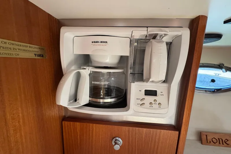 Lone Star Yacht Photos Pics Black & Decker coffee maker in 2005 Tiara Yachts 3200 Open cabin kitchen.