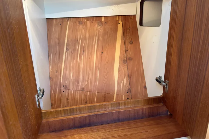 Lone Star Yacht Photos Pics Wooden interior cabinet of 2005 Tiara Yachts 3200 Open, showcasing craftsmanship and design.