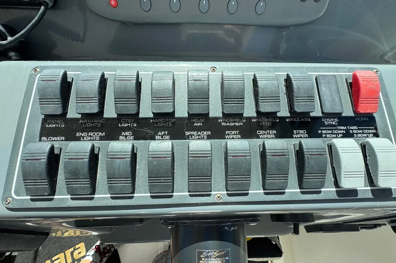 Lone Star Yacht Photos Pics Control panel of a 2005 Tiara Yachts 3200 Open with various switches and labels.