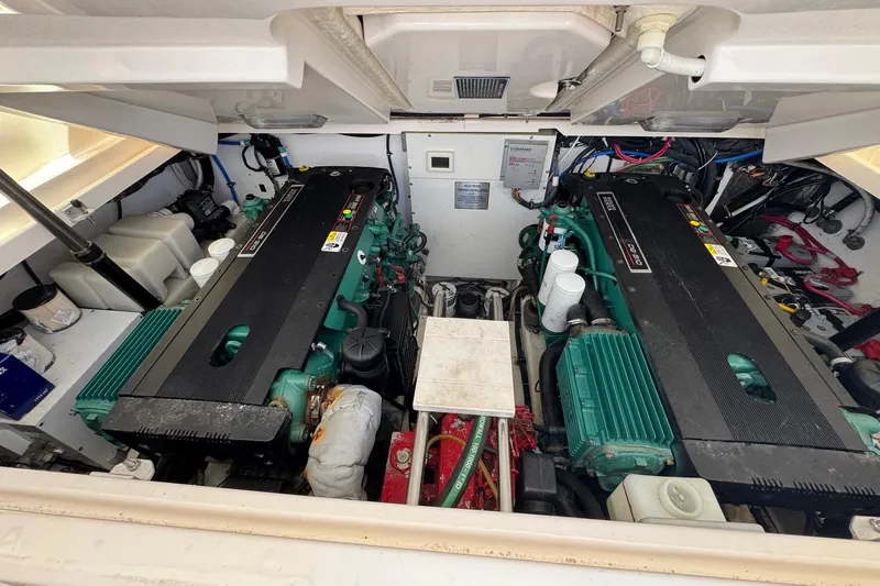 Lone Star Yacht Photos Pics Engine compartment of a 2005 Tiara Yachts 3200 Open, showcasing dual engines and components.