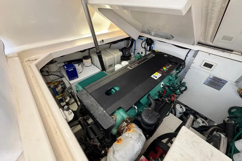 Lone Star Yacht Photos Pics Engine compartment of a 2005 Tiara Yachts 3200 Open, showcasing detailed mechanical components.