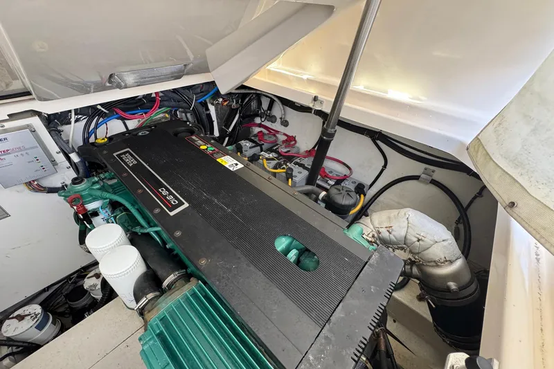 Lone Star Yacht Photos Pics Engine compartment of a 2005 Tiara Yachts 3200 Open, showcasing detailed mechanical components.