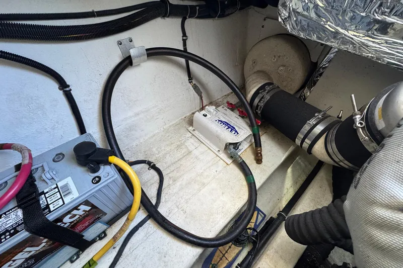 Lone Star Yacht Photos Pics Engine compartment of a 2005 Tiara Yachts 3200 Open, featuring battery and wiring.