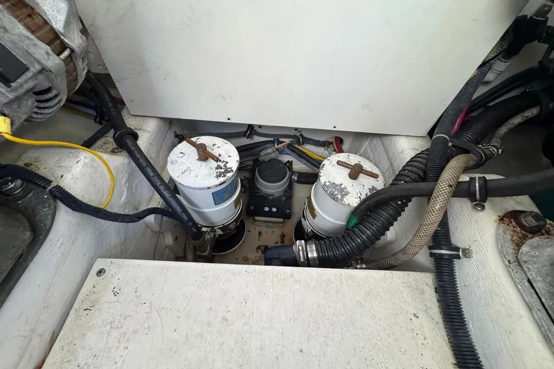 Lone Star Yacht Photos Pics Engine compartment of a 2005 Tiara Yachts 3200 Open, showing filters and wiring.