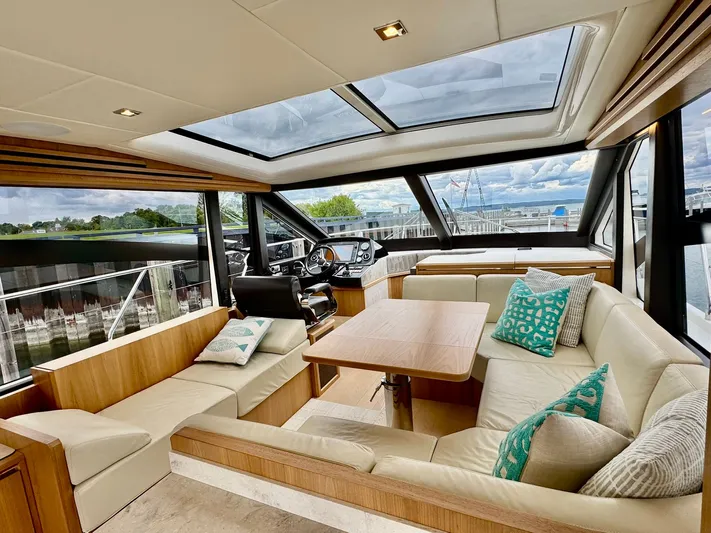 Yes Dear! Yacht Photos Pics Luxurious 2016 Absolute Sport Yacht interior with plush seating and panoramic windows.