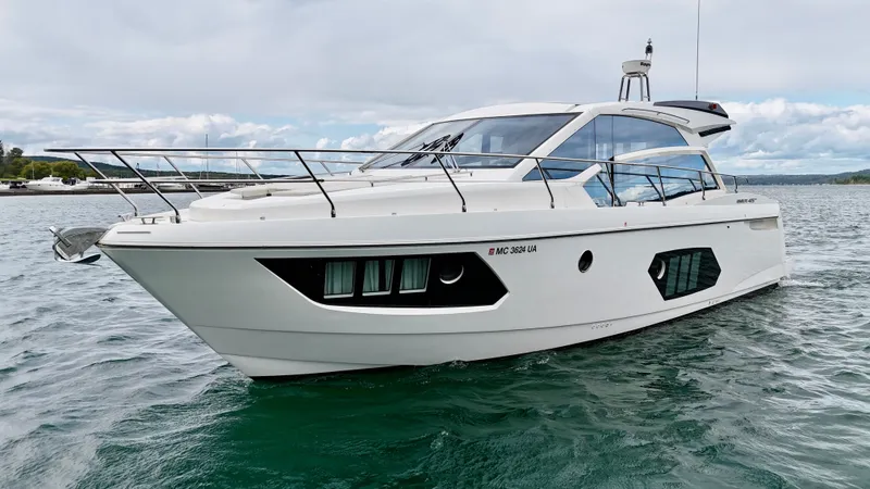 Yes Dear! Yacht Photos Pics 2016 Absolute Sport Yacht on calm water, showcasing sleek design and modern features.