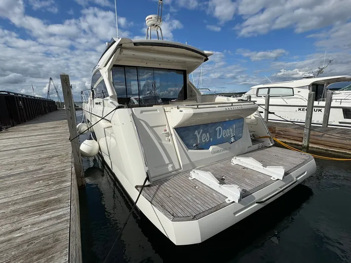 Yes Dear! Yacht Photos Pics 2016 Absolute Sport Yacht docked at marina under cloudy sky.