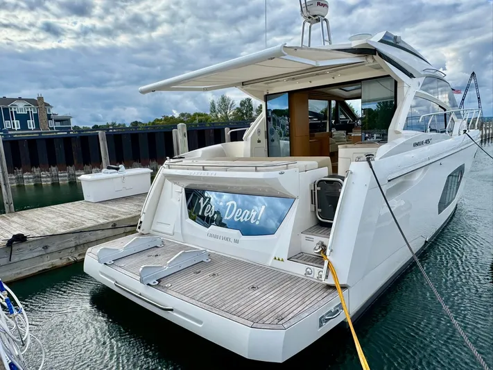 Yes Dear! Yacht Photos Pics 2016 Absolute Sport Yacht docked, rear view with open deck and water reflections.