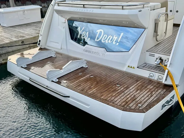 Yes Dear! Yacht Photos Pics 2016 Absolute Sport Yacht with wooden deck, docked at marina.