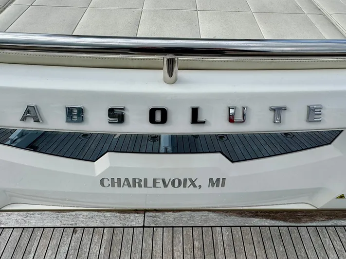 Yes Dear! Yacht Photos Pics 2016 Absolute Sport Yacht stern with "Charlevoix, MI" inscription.