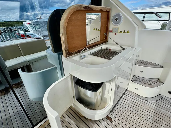 Yes Dear! Yacht Photos Pics Outdoor kitchenette on a 2016 Absolute Sport Yacht with grill and sink.