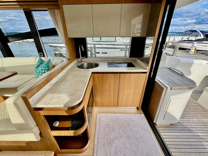Yes Dear! Yacht Photos Pics Luxurious 2016 Absolute Sport Yacht interior with modern kitchen and scenic marina view.