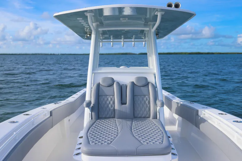  Yacht Photos Pics 2025 Invincible 33 Open Fisherman boat on open water, featuring sleek seating and modern design.