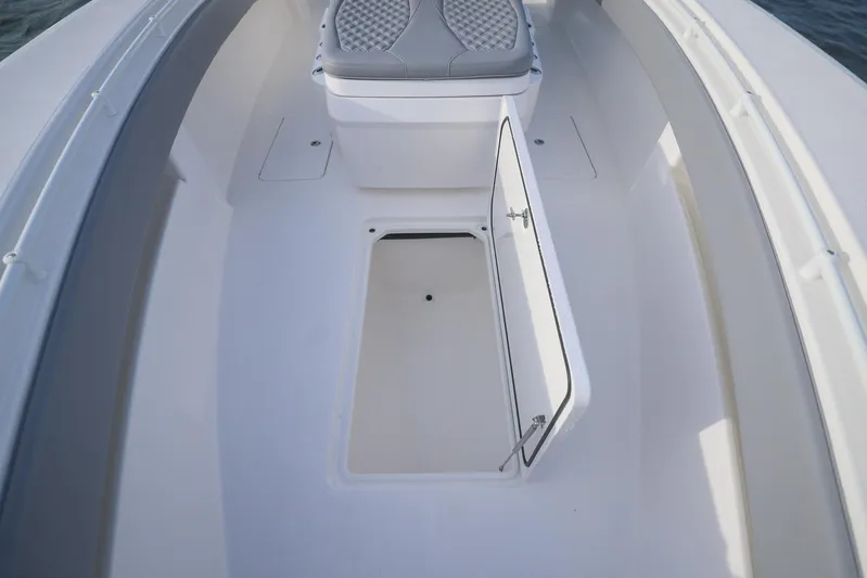  Yacht Photos Pics 2025 Invincible 33 Open Fisherman boat interior with open storage compartment.