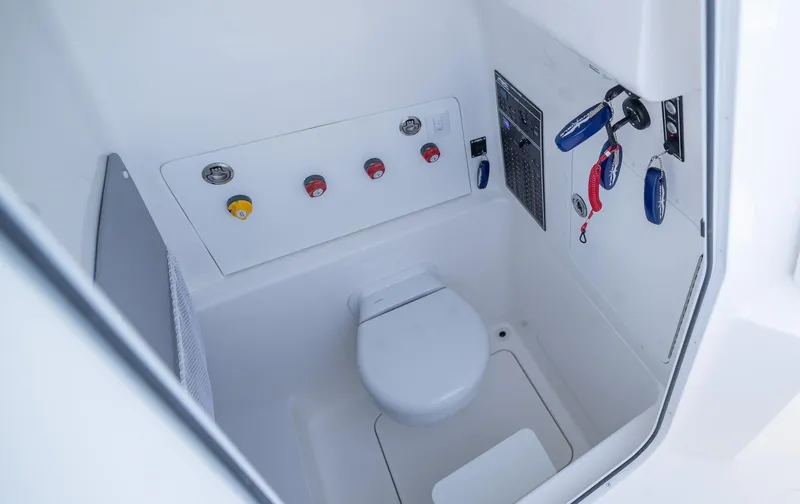  Yacht Photos Pics 2025 Invincible 33 Open Fisherman boat interior with modern marine toilet.