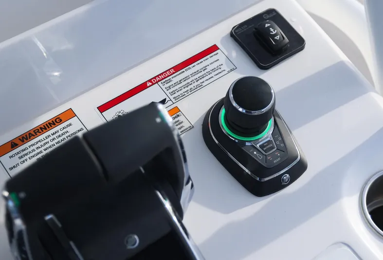  Yacht Photos Pics 2025 Invincible 33 Open Fisherman boat controls with warning labels and joystick.