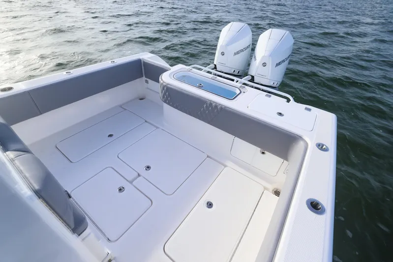  Yacht Photos Pics 2025 Invincible 33 Open Fisherman boat with twin engines on the water.