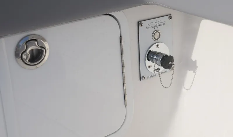  Yacht Photos Pics 2025 Invincible 33 Open Fisherman boat detail, featuring a fuel cap and electrical connection.