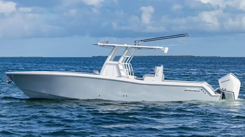  Yacht Photos Pics 2025 Invincible 33 Open Fisherman boat on the ocean, side view.