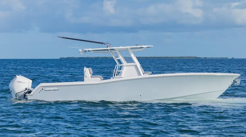  Yacht Photos Pics 2025 Invincible 33 Open Fisherman boat cruising on the ocean.
