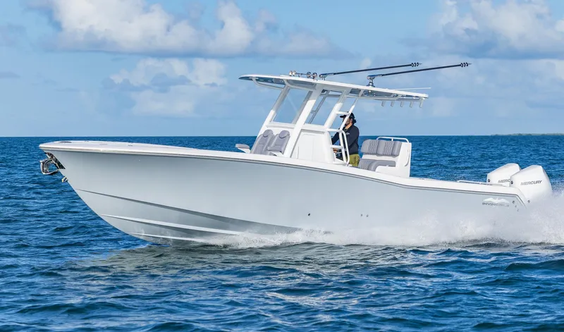  Yacht Photos Pics 2025 Invincible 33 Open Fisherman boat cruising on open water.