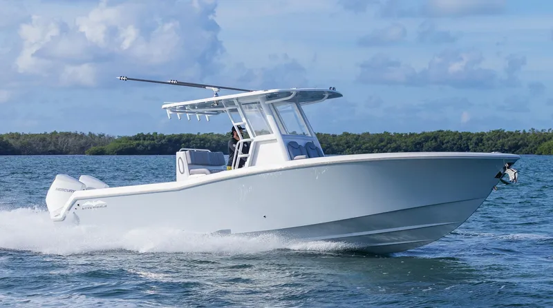  Yacht Photos Pics 2025 Invincible 33 Open Fisherman boat cruising on open water.