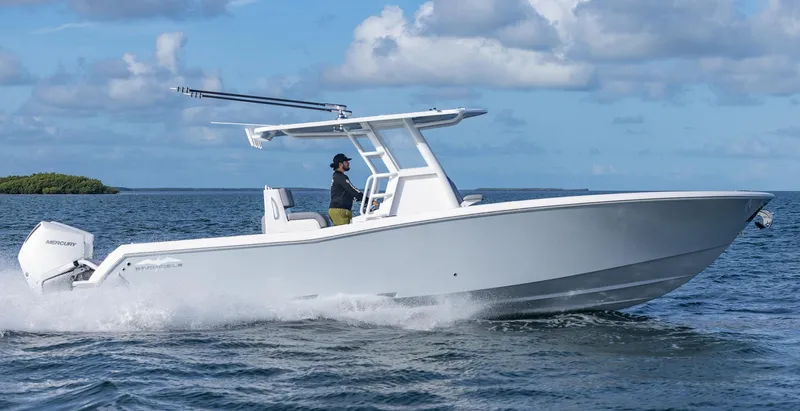  Yacht Photos Pics 2025 Invincible 33 Open Fisherman boat cruising on the ocean.